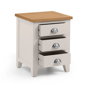 Wooden nightstand with three drawers on a white background