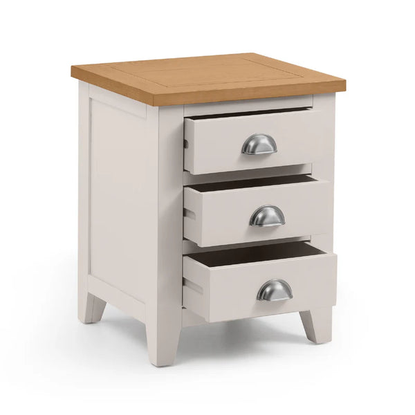 Wooden nightstand with three drawers on a white background