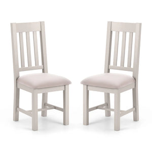 Two gray wooden chairs with beige cushioned seats on a white background