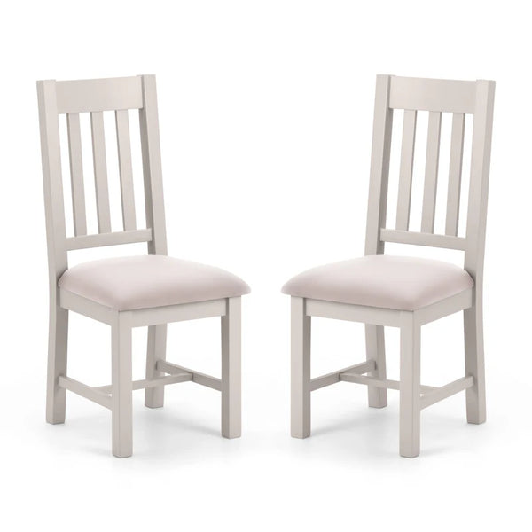 Two gray wooden chairs with beige cushioned seats on a white background