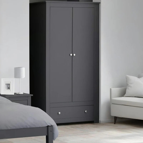 Gray wardrobe in a bedroom with a bed and sofa.