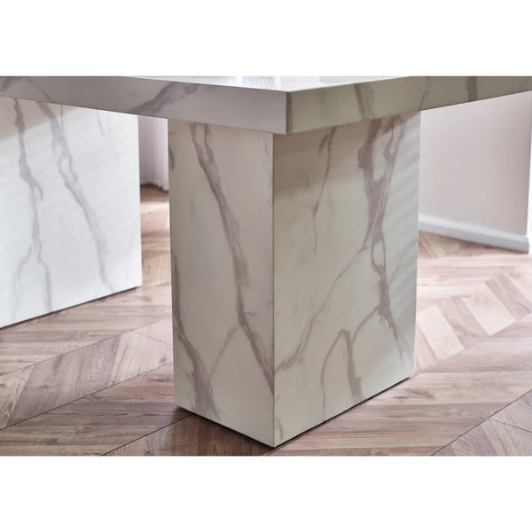 Marble-patterned dining table on a wooden floor