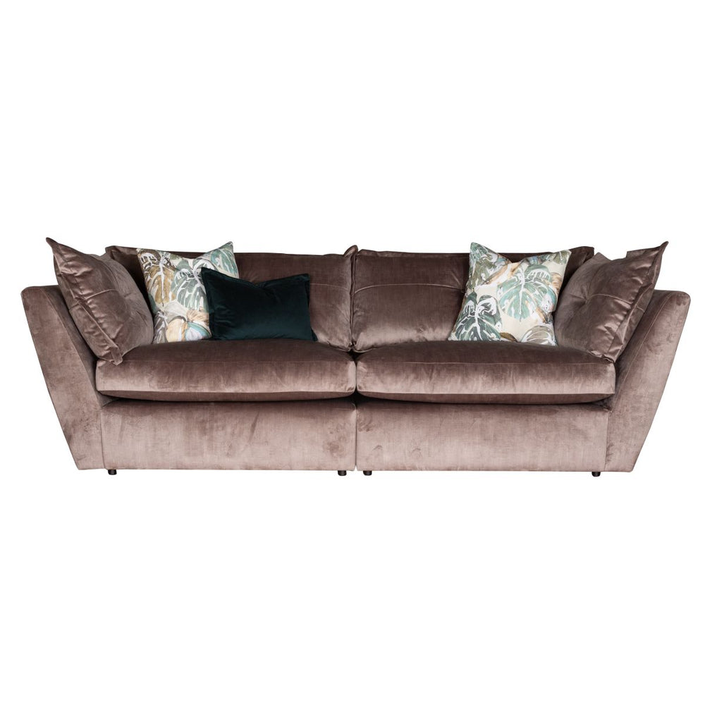 Brown sofa with decorative pillows on a white background