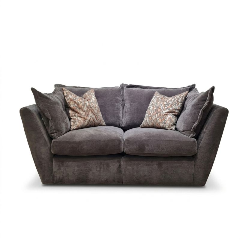Gray sofa with patterned cushions on a white background