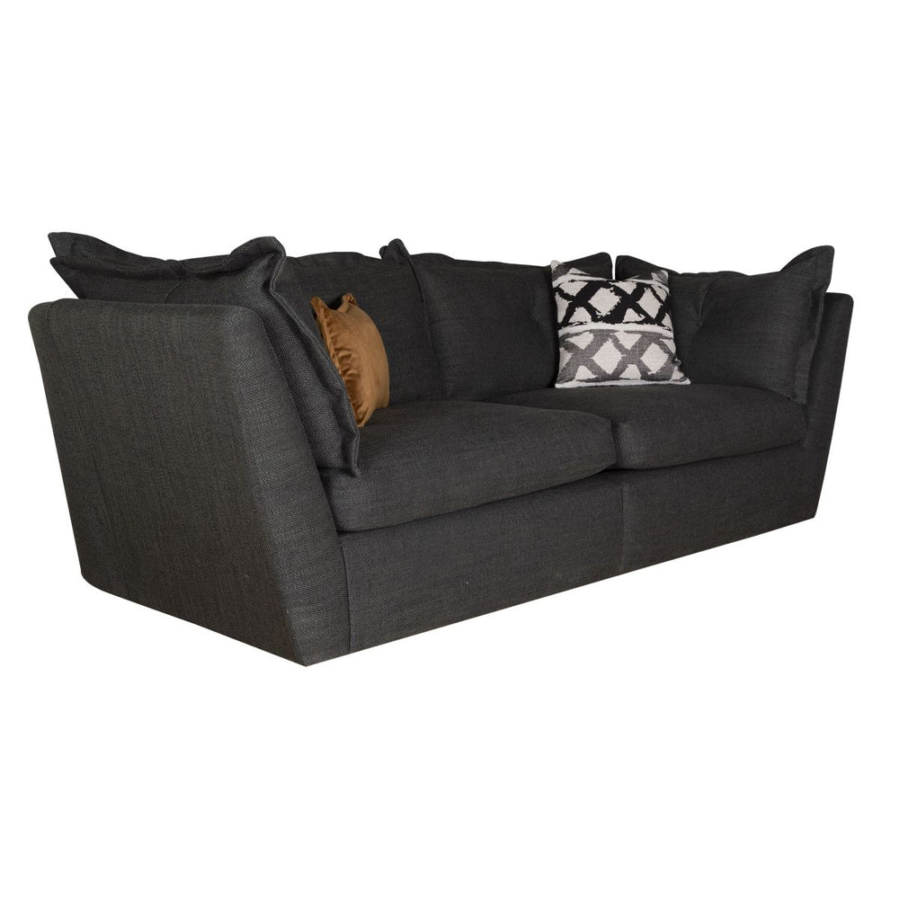 Gray sofa with decorative pillows on a white background
