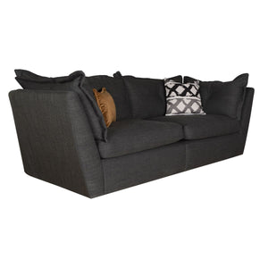 Gray sofa with decorative pillows on a white background