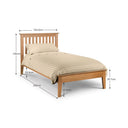 Wooden bed with dimensions labeled on a white background