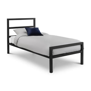 Black metal bed frame with white bedding and a blue pillow on a white background