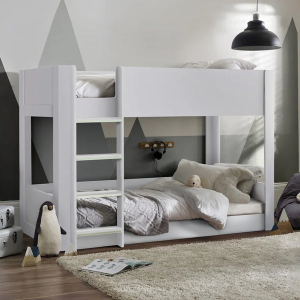 White bunk bed with shelves in a room setting