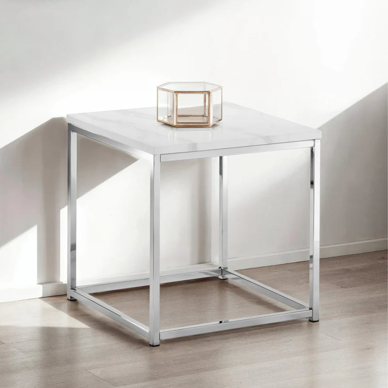 white marble lamp table with chrome legs on a white background