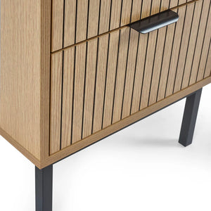 Wooden cabinet with slatted design and black legs on a white background