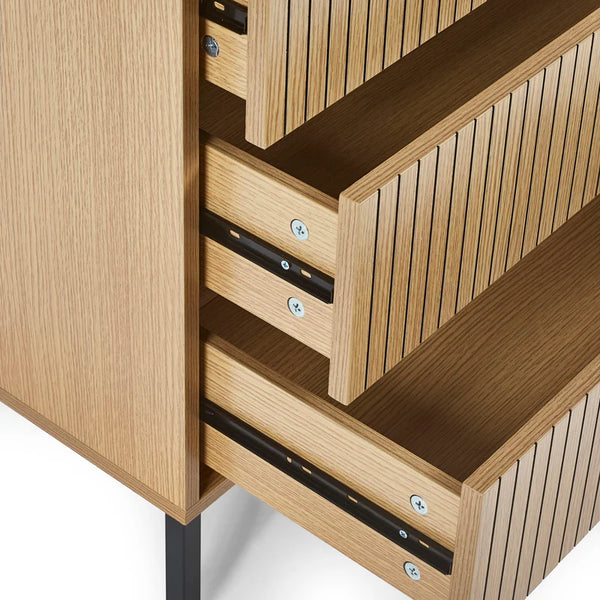 Wooden cabinet with open drawers and slatted design on a white background