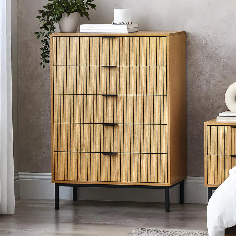 Wooden dresser with multiple drawers on a white background