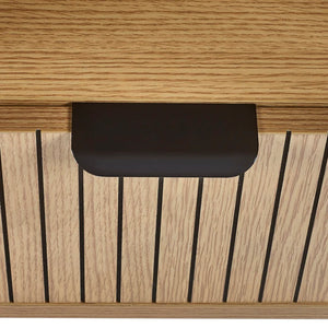 Close-up of a wooden surface with a black handle