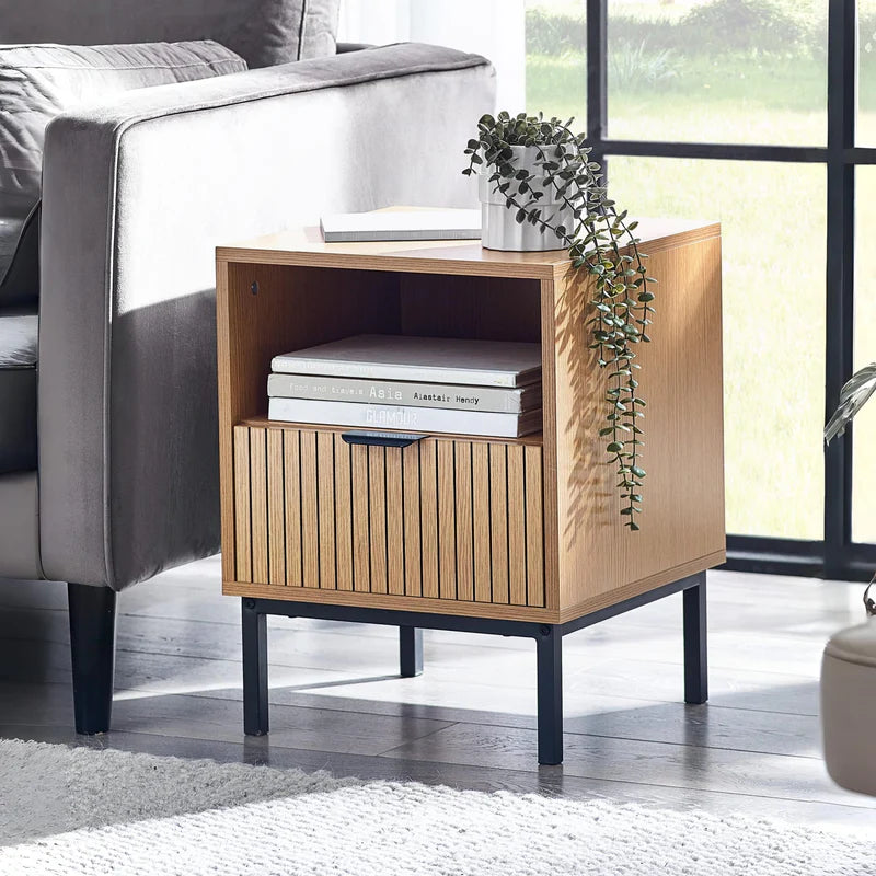 Wooden side table with a white top and black legs on a white background