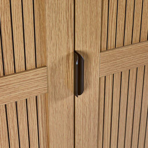 Close-up of a wooden cabinet with a handle