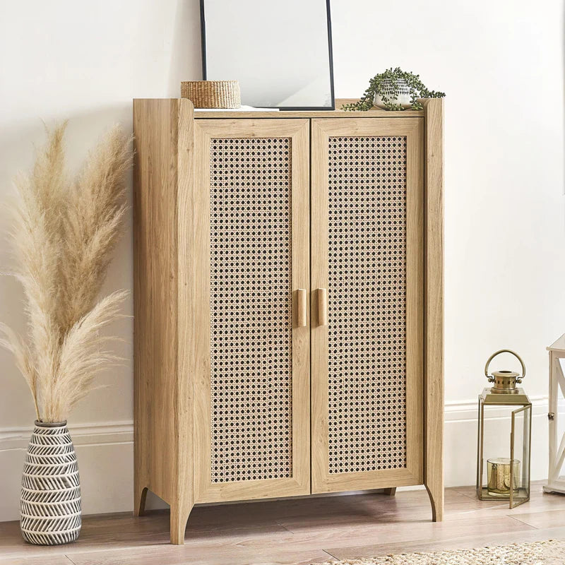 Wooden cabinet with wicker doors on a white background