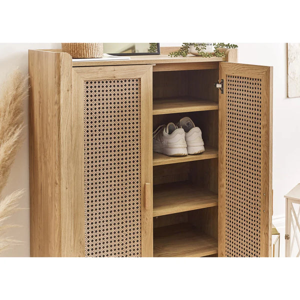 shoe cupboard open doors with trainers inside