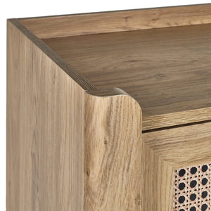 Wooden furniture corner with a geometric patterned drawer.