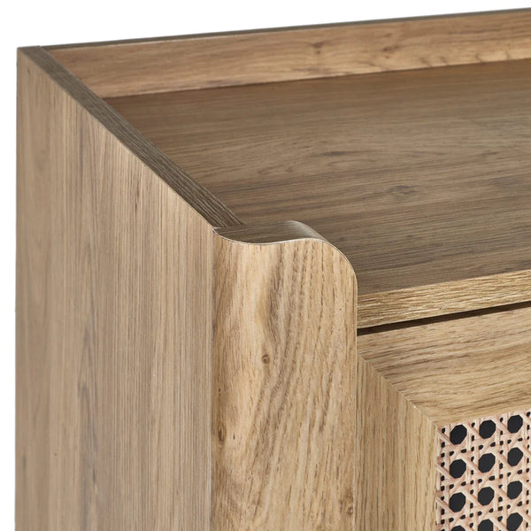 Wooden furniture corner with a geometric patterned drawer.