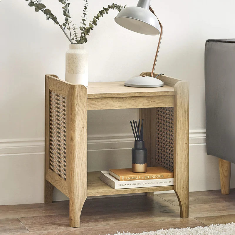 Wooden side table with woven design on a white background
