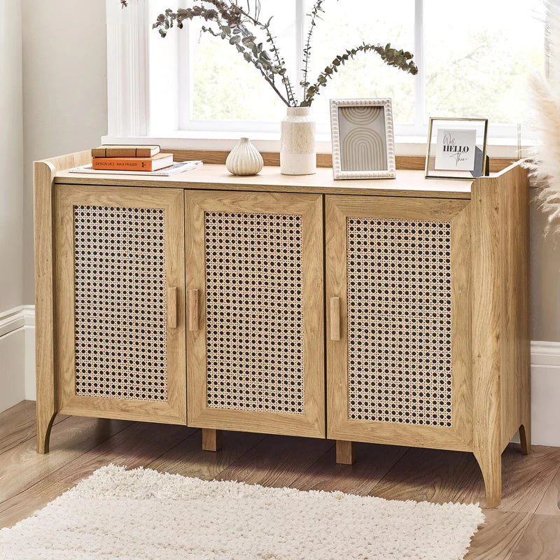 Wooden sideboard with rattan doors on a white background