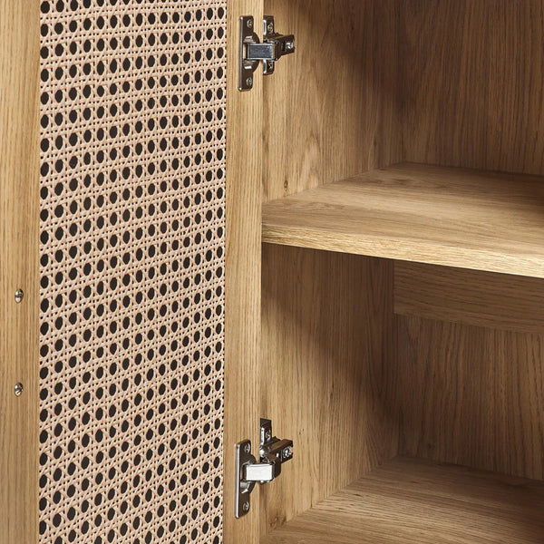 Wooden cabinet with perforated patterned door and visible hinges.