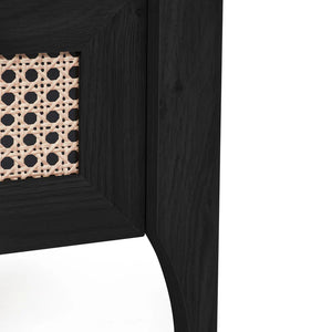 Close-up of a black wooden corner unit with woven pattern