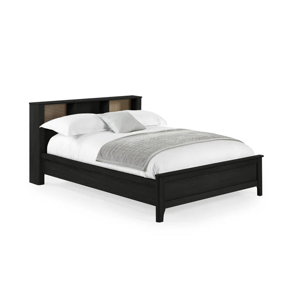 Black bed frame with white bedding on a white background