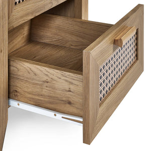 Wooden drawer with a patterned fabric lining on a white background