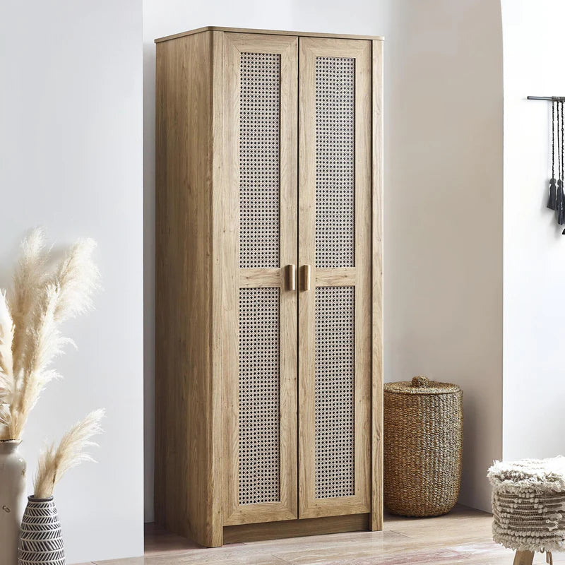 Wooden wardrobe with rattan-style mesh doors on a white background