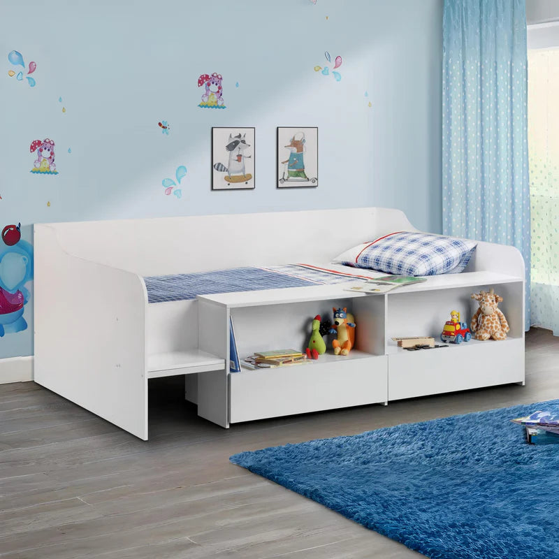 White children's bed with storage compartments and toys on a white background
