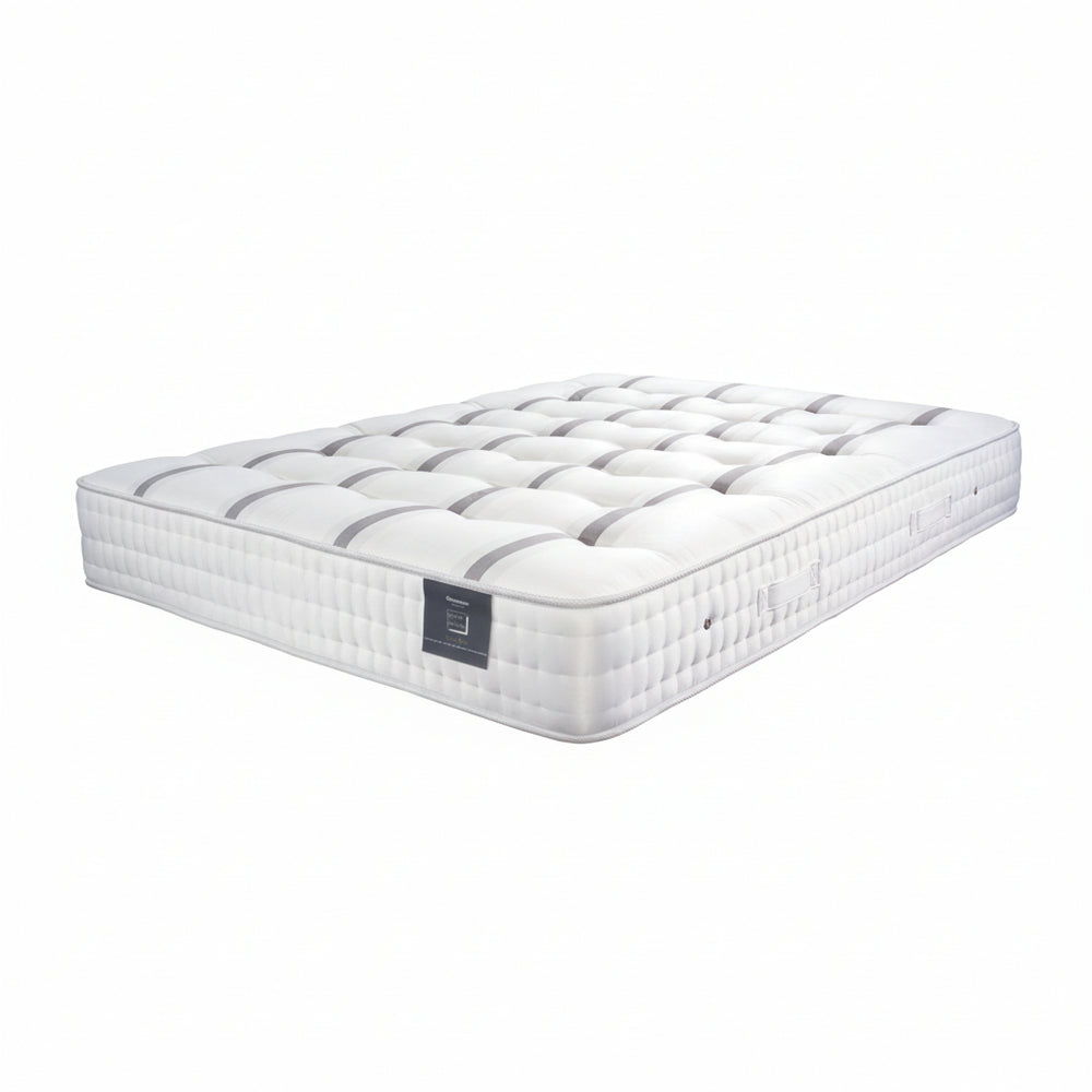 White mattress with a brand logo on a white background