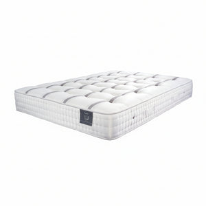 White mattress with a brand logo on a white background