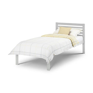 Grey bed frame with white bedding and a yellow blanket on a white background