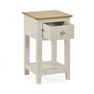 Small side table with wooden top and drawer on a white background