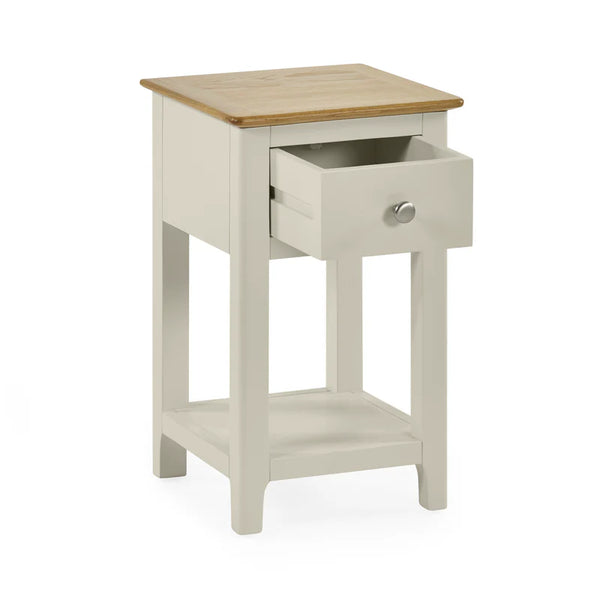 Small side table with wooden top and drawer on a white background
