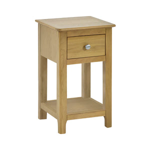 Wooden side table with a drawer on a white background