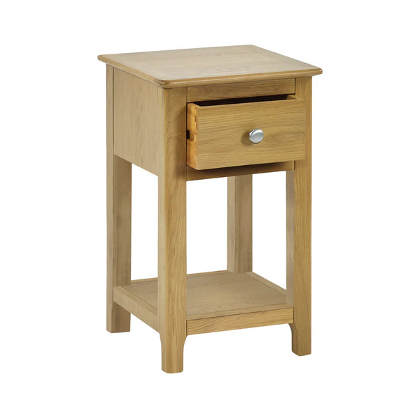 Wooden side table with a drawer on a white background