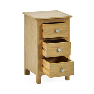 Wooden nightstand with three drawers on a white background