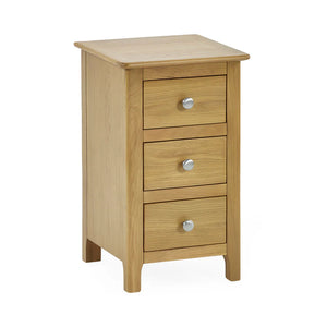 Wooden nightstand with three drawers and silver knobs on a white background