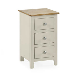 Three-drawer nightstand with wooden top on a white background
