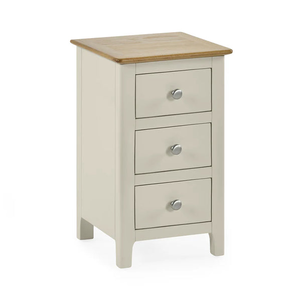 Three-drawer nightstand with wooden top on a white background