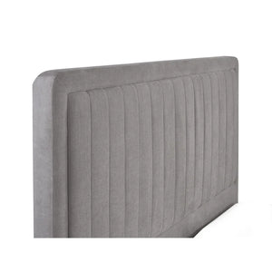 Gray upholstered headboard with a ribbed texture on a white background