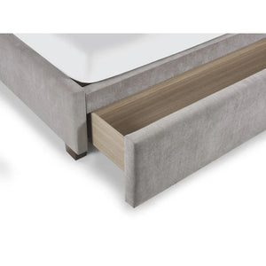Close-up of a bed frame with wooden slats and gray upholstered headboard on a white background