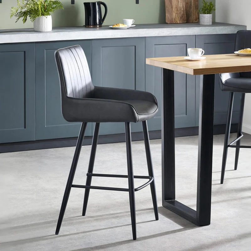 Gray bar stool with black legs on a white background