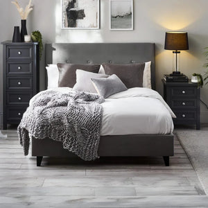 Modern bedroom with a gray bed, nightstands, and decor.