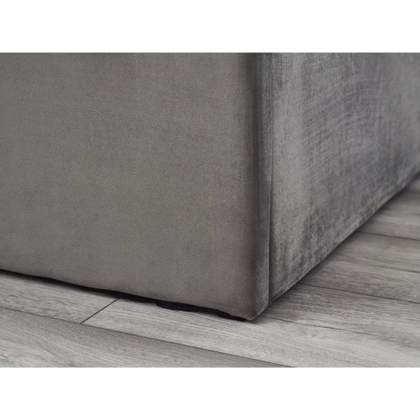 Gray textured fabric corner on a wooden floor