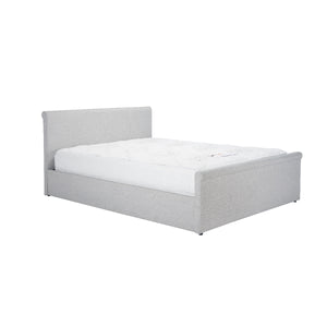 Gray upholstered bed with white mattress on a white background