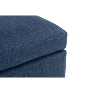 Blue fabric ottoman on a white background